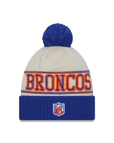 Denver Broncos New Era 2023 Sideline Historic Pom Cuffed Knit Hat - Cream/Royal - Pro League Sports Collectibles Inc.
