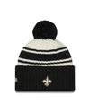 New Orleans Saints New Era 2022 Sideline - Sport Cuffed Pom Knit Hat - Cream/Black - Pro League Sports Collectibles Inc.