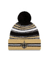 Youth New Orleans Saints New Era 2021 NFL Sideline - Sport Official Pom Cuffed Knit Hat - Gold/Black - Pro League Sports Collectibles Inc.