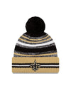 New Orleans Saints New Era 2021 NFL Sideline - Sport Official Pom Cuffed Knit Hat - Gold/Black - Pro League Sports Collectibles Inc.