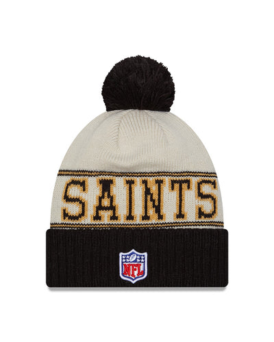 New Orleans Saints New Era 2023 Sideline Historic Pom Cuffed Knit Hat - Cream/Black - Pro League Sports Collectibles Inc.