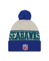 Seattle Seahawks New Era 2023 Sideline Historic Pom Cuffed Knit Hat - Cream/Blue - Pro League Sports Collectibles Inc.