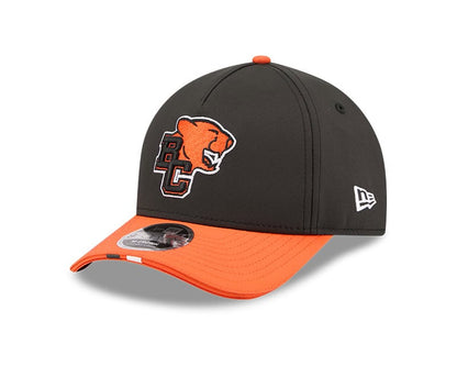 British Columbia Lions CFL 2026 New Era On-Field Side Line 9FORTY M-Crown A- Frame Adjustable Hat - 2 Tone Black/Orange