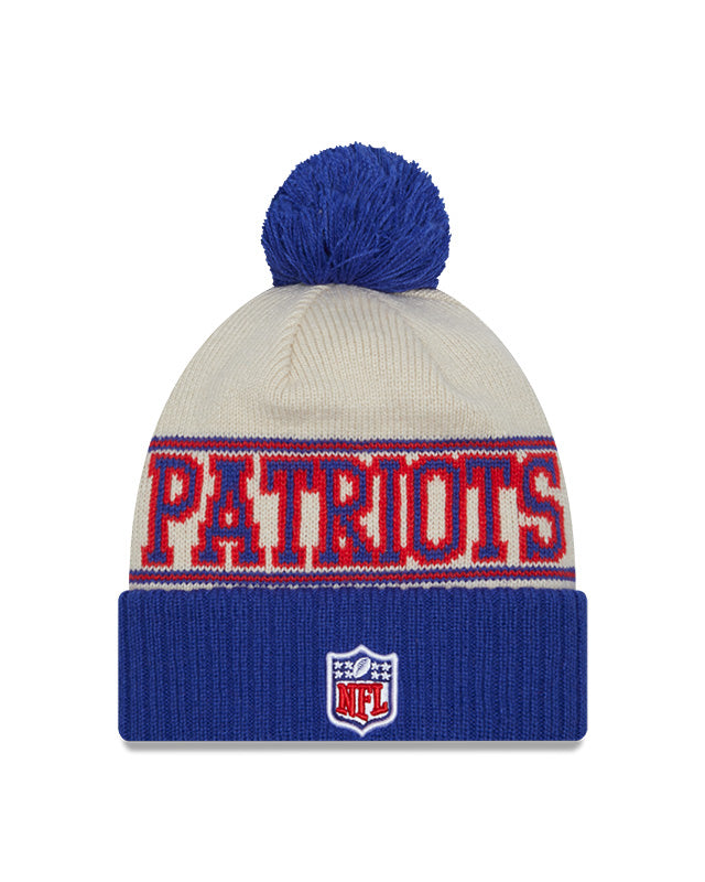 New England Patriots New Era 2023 Sideline Historic Pom Cuffed Knit Hat - Cream/Blue - Pro League Sports Collectibles Inc.