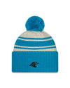 Carolina Panthers New Era 2022 Sideline - Sport Cuffed Pom Knit Hat - Cream/Blue - Pro League Sports Collectibles Inc.
